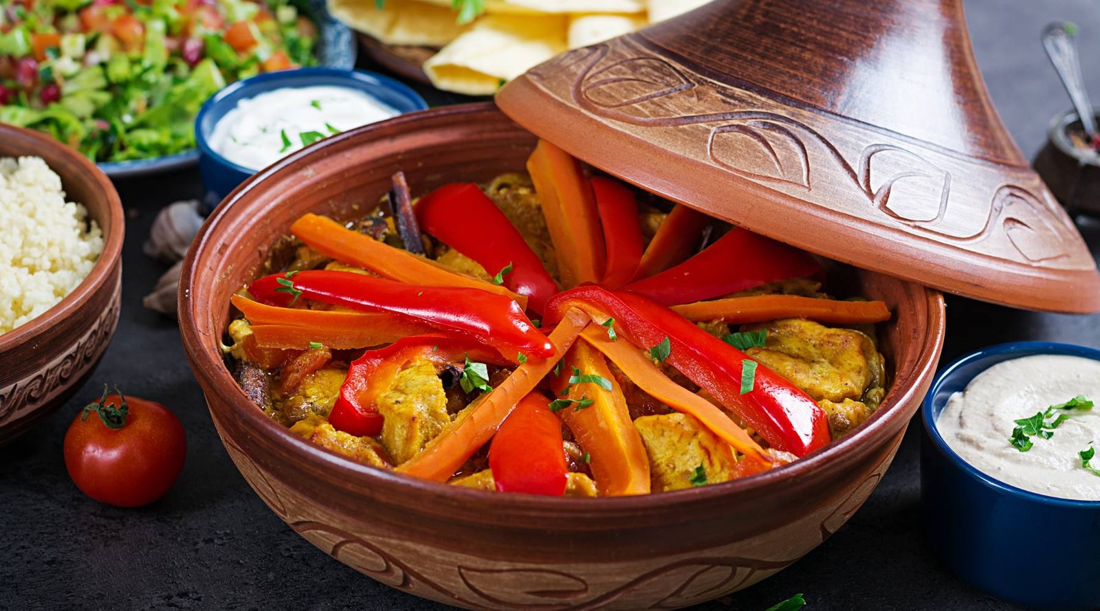 Morrocan cuisine chicken tajine, couscous and salad